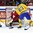 HELSINKI, FINLAND - DECEMBER 26: Switzerland's Joren Van Pottelberghe #30 makes a stick save off a shot from Sweden's Oskar Lindblom #23 during preliminary round action at the 2016 IIHF World Junior Championship. (Photo by Matt Zambonin/HHOF-IIHF Images)

